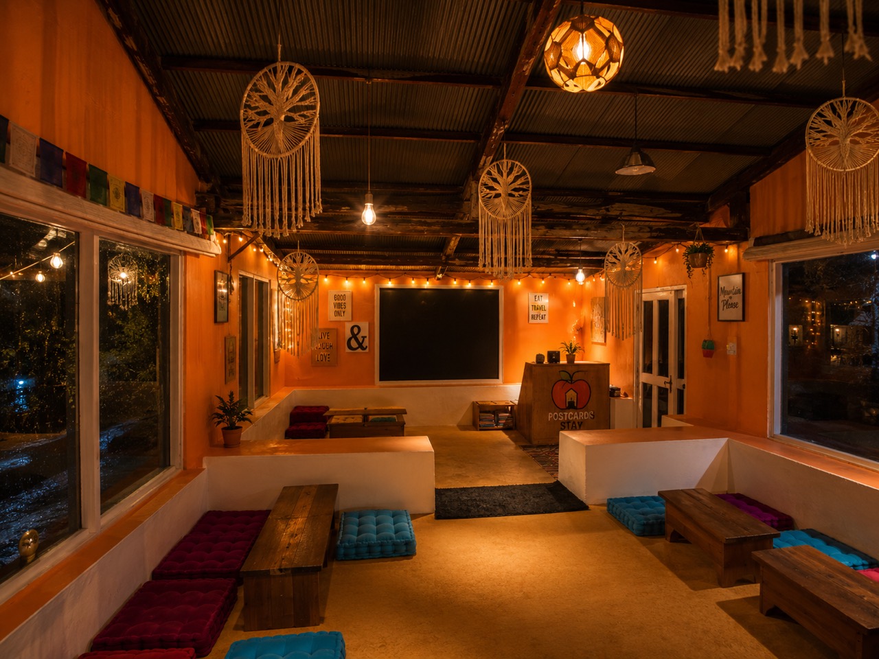The River Café — warm floor seating, macramé and fairy lights